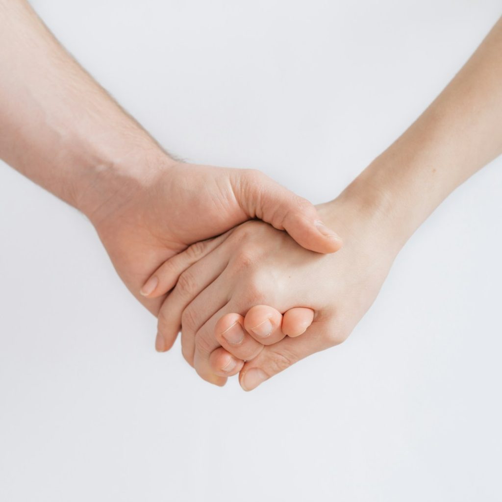 woman and man holding hands