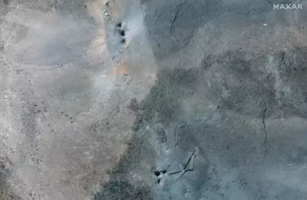 Image showing craters in aftermath of US military attacks