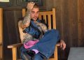 Justin Bieber sitting on porch chair