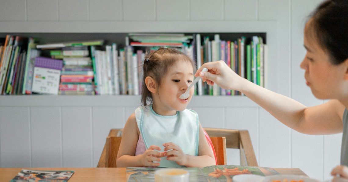 Mother feeding child