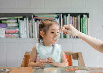 Mother feeding child