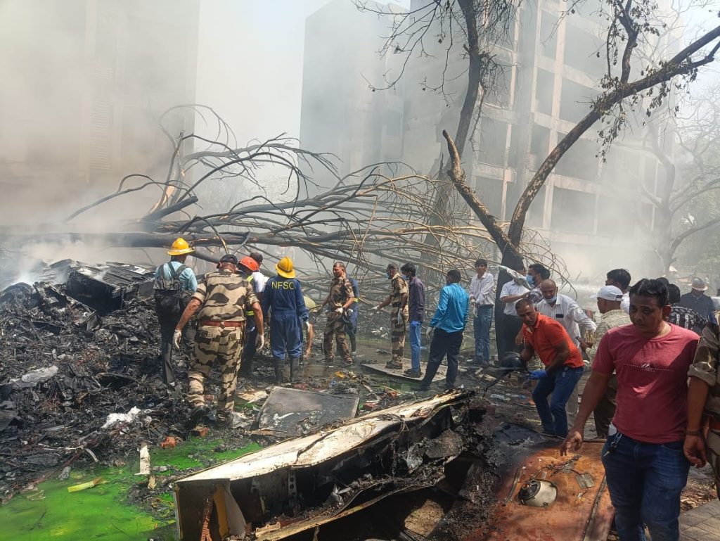 People at the Ahmedabad plane crash site
