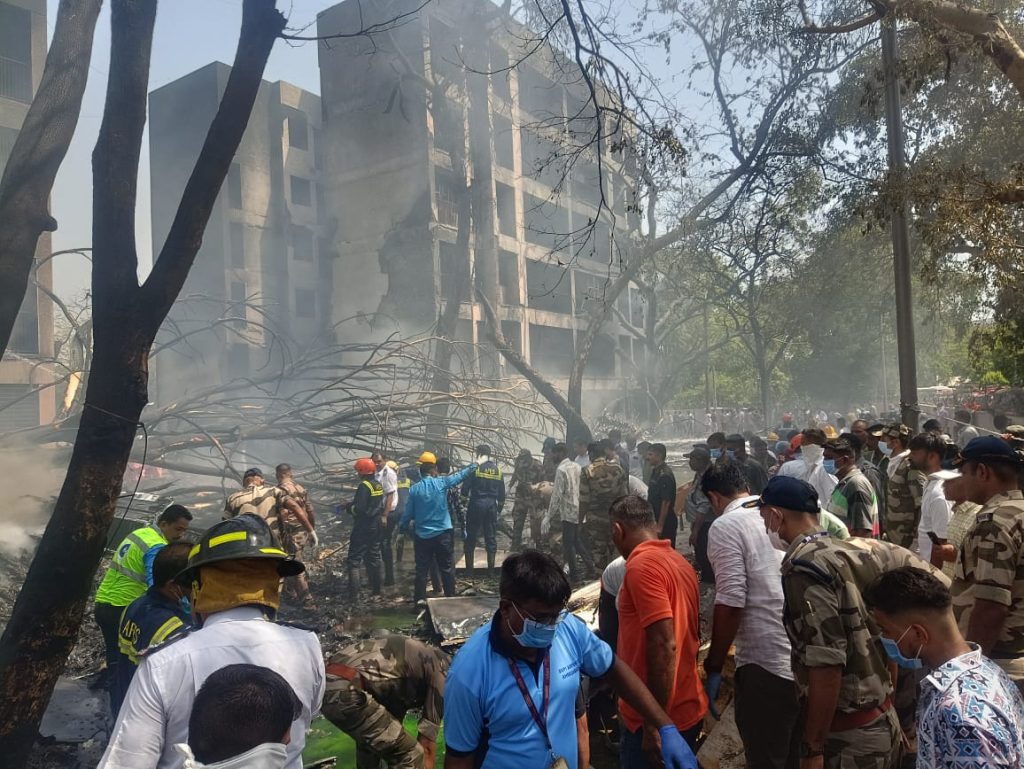 People at the Ahmedabad plane crash site