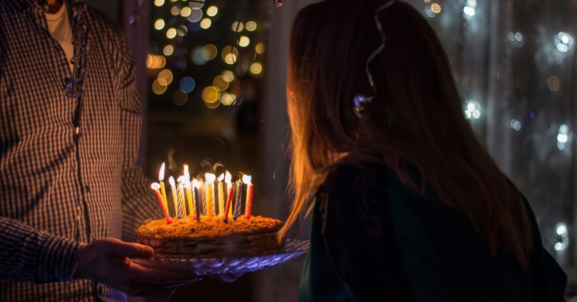 Woman about to blow birthday candles