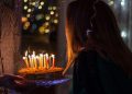 Woman about to blow birthday candles