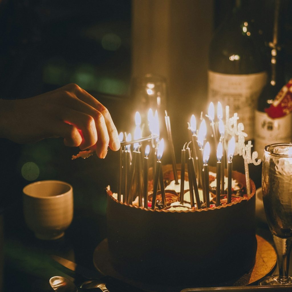 lighted candles on black table