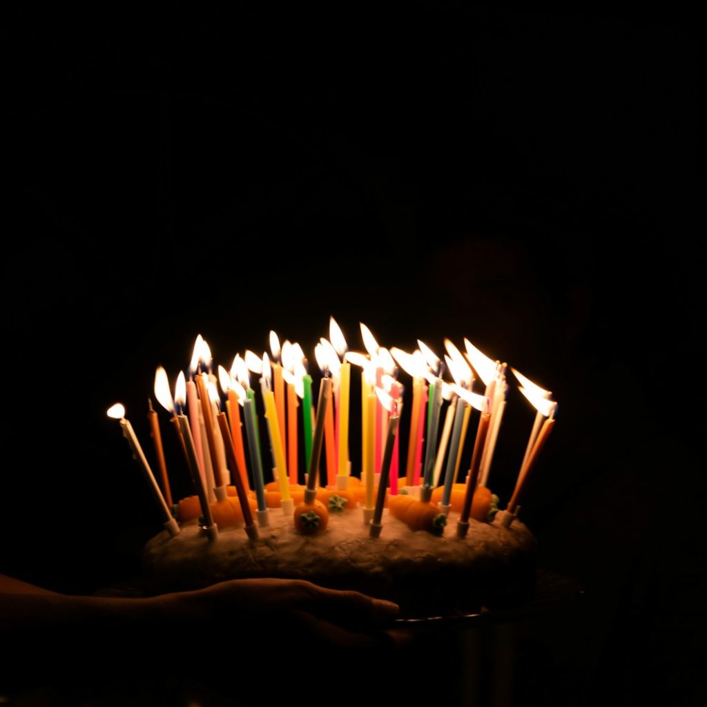 lighted candles on cake