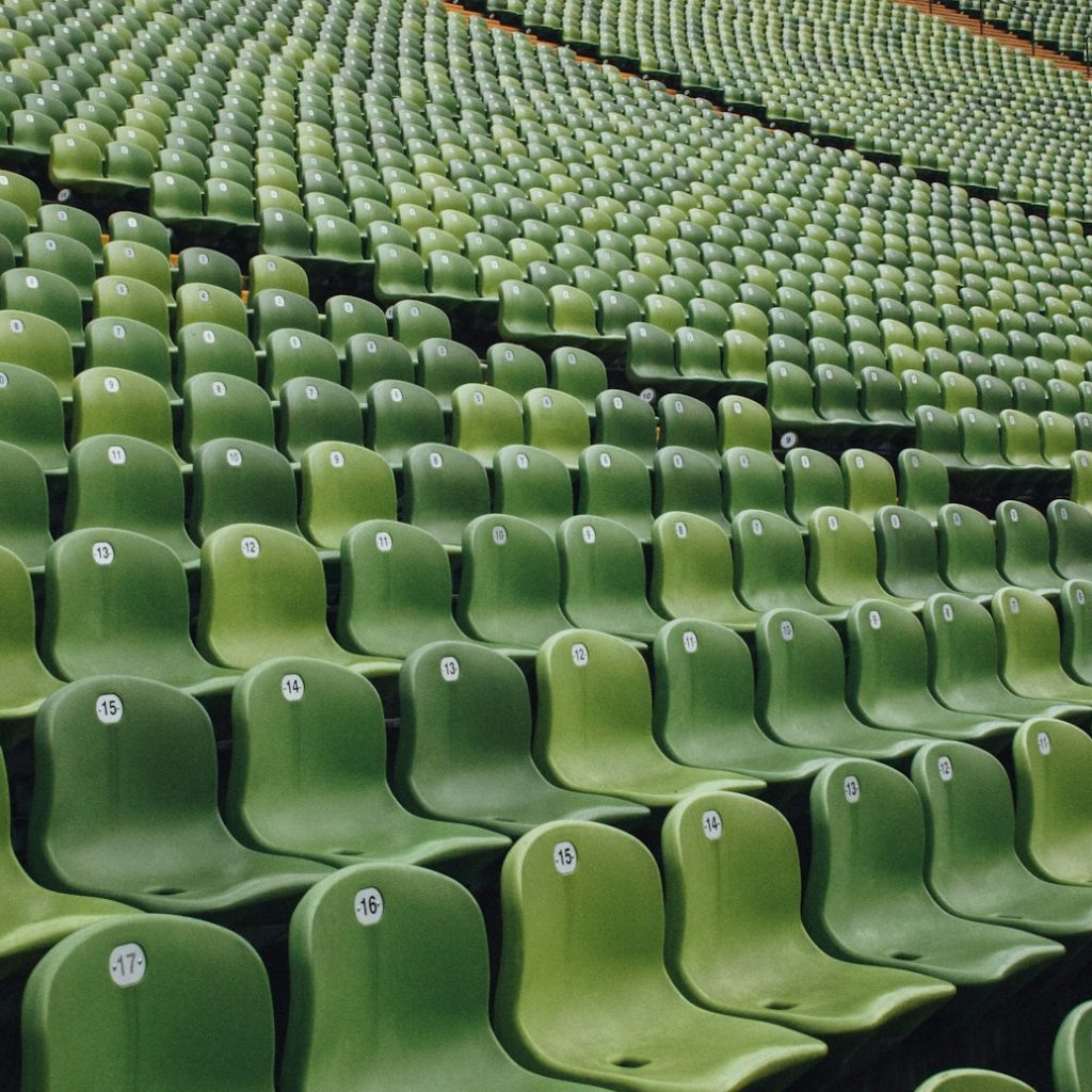 green and black metal chairs