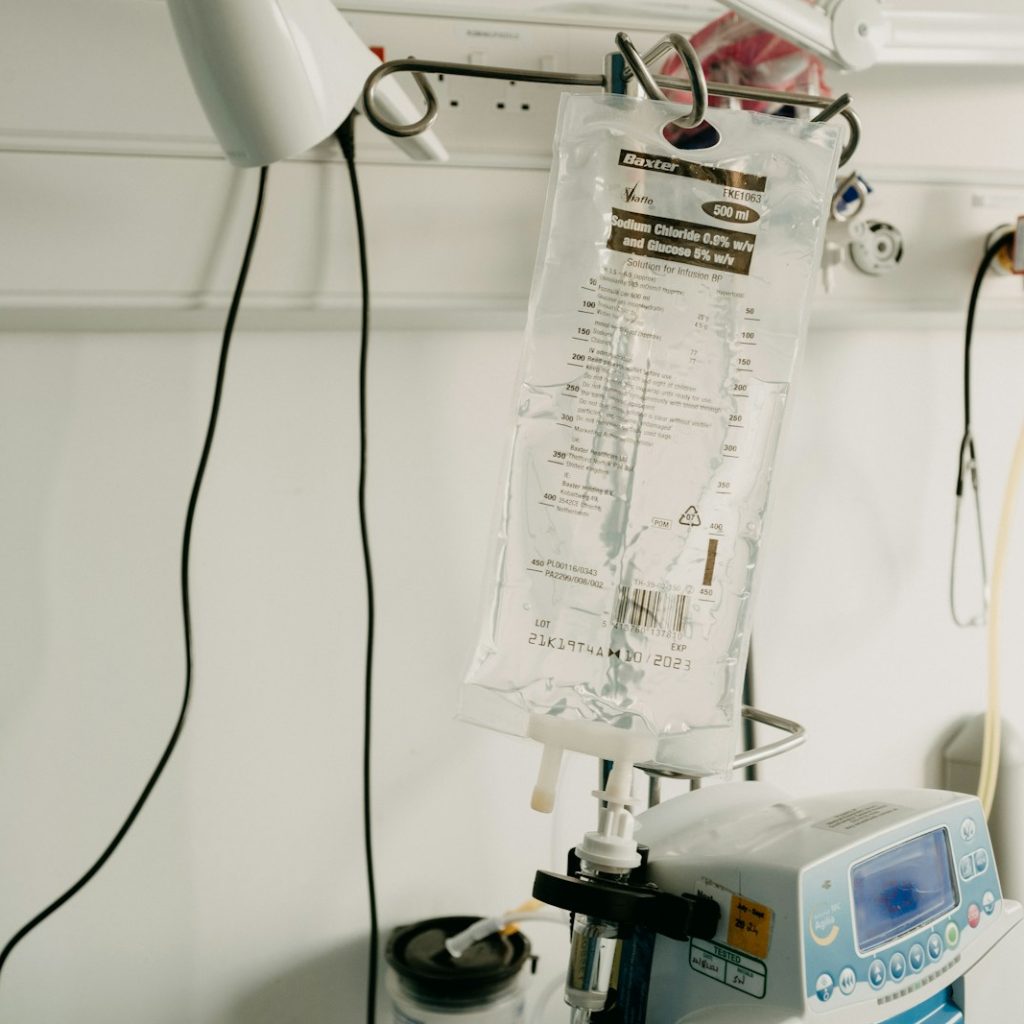 a hospital room with a monitor and medical equipment