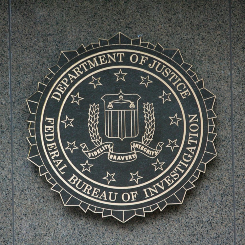 the seal of the department of justice on a wall