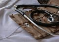 Black stethoscope with brown leather case
