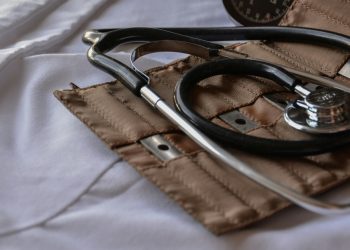 Black stethoscope with brown leather case