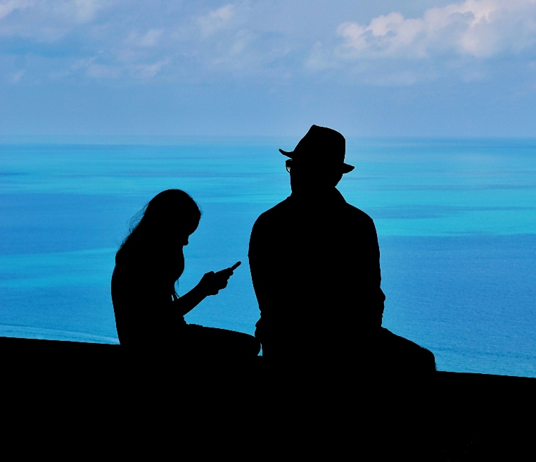 Father daughter shadow by the sea