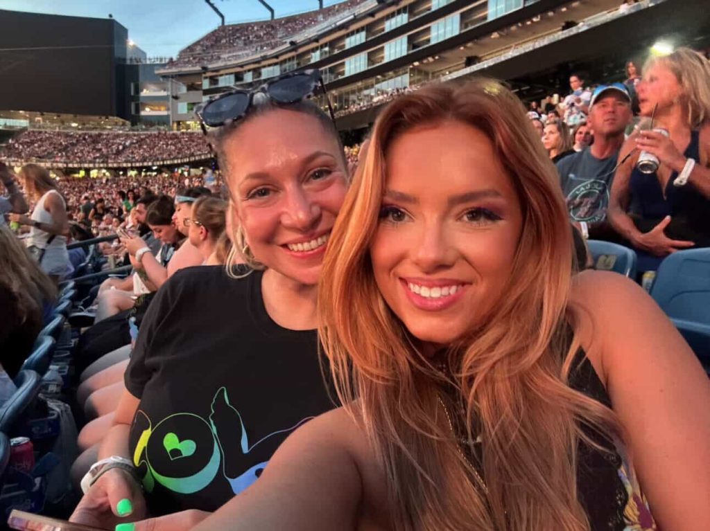 Grace Springer with friend at Coldplay concert