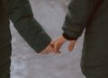 Man and woman holding hands