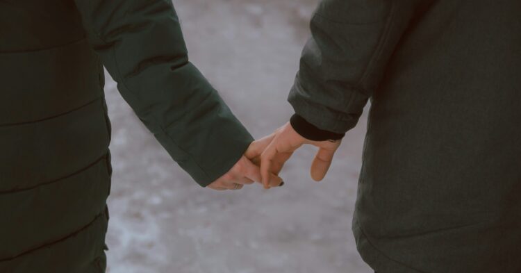 Man and woman holding hands