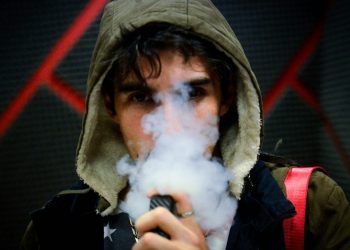 Young man vaping